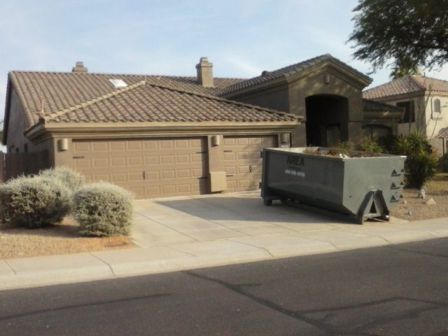 Residential roll-off dumpster in a Scottsdale driveway